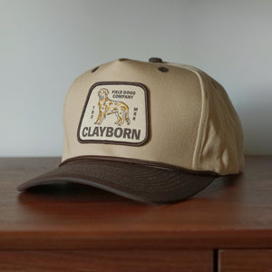 Field Good Co. Patch Hat - tan cotton twill snapback with chocolate brown brim and woven golden retriever trademark patch, Clayborn & Co.