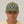Front View of the Raccoon Baseball Hat in Army Green Cotton Canvas on top of a man wearing the hat. Embroidered raccoon head design on the crown.  