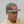 Green Surf Cap  with red and white Clayborn vibe style patch Surf Cap on Model Looking Off to the side. 